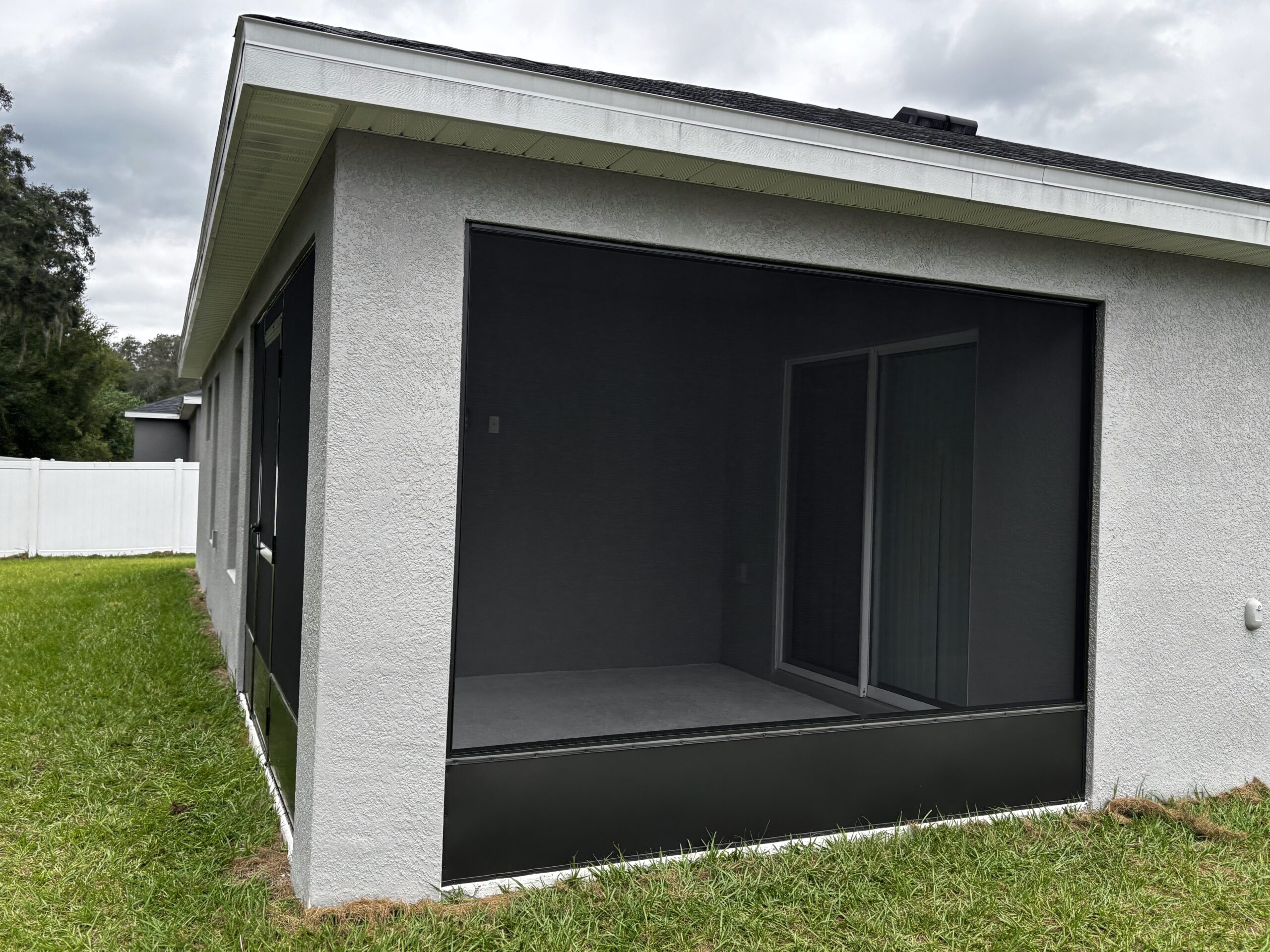 Aluminum frame and screen panel detail on a screened lanai in Marion County, FL