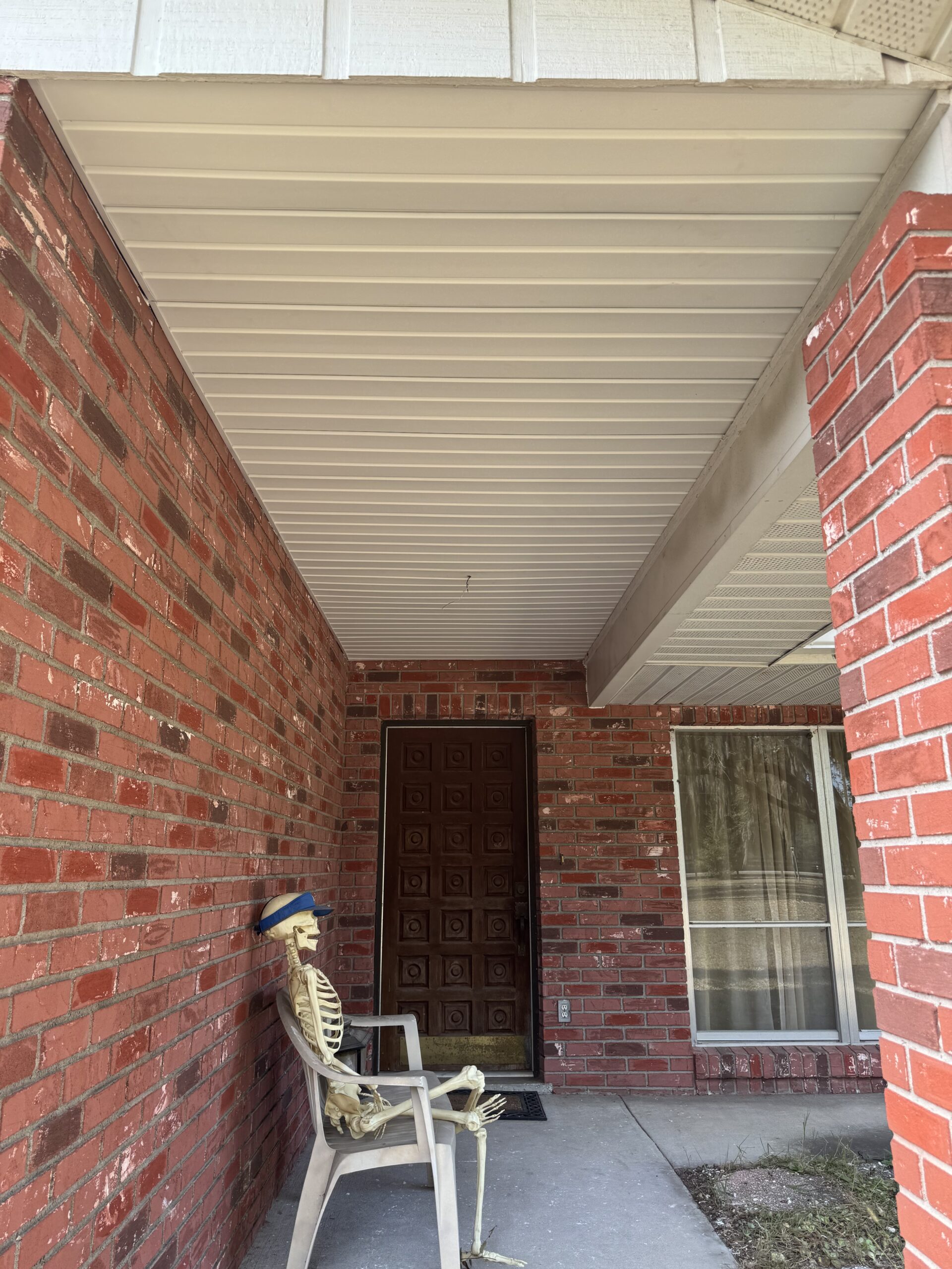 Aluminum soffit installed on covered entryway of a Florida home
