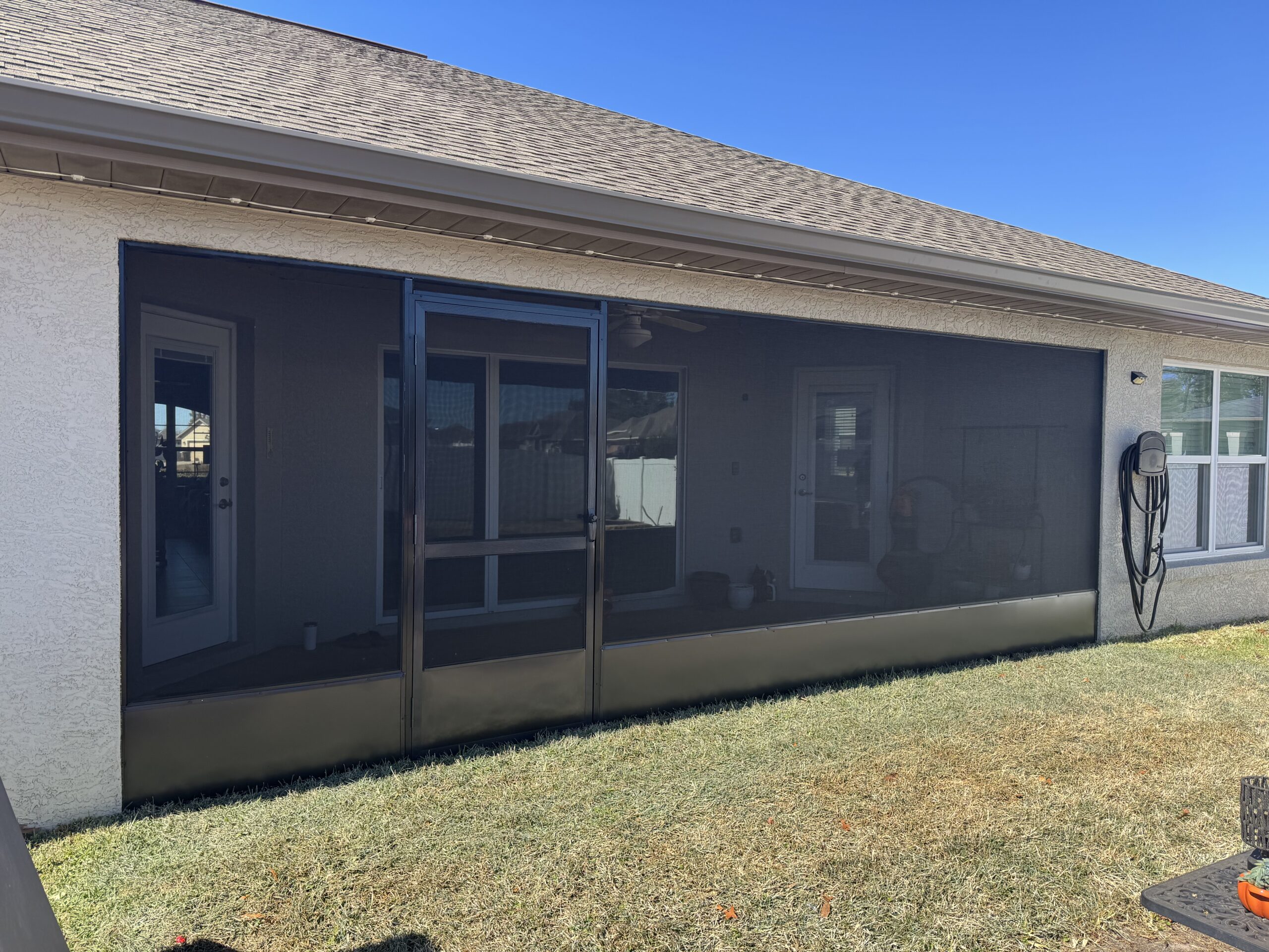 Custom screened patio enclosure built by Brownings Aluminum on a Marion County, FL home