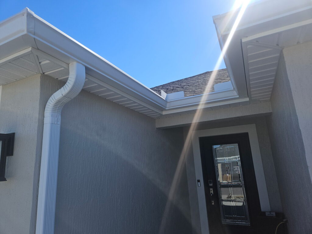 Seamless gutter system installed along the roofline of a Central Florida home for efficient water flow