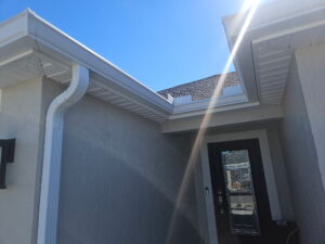 Seamless gutter system installed along the roofline of a Central Florida home for efficient water flow